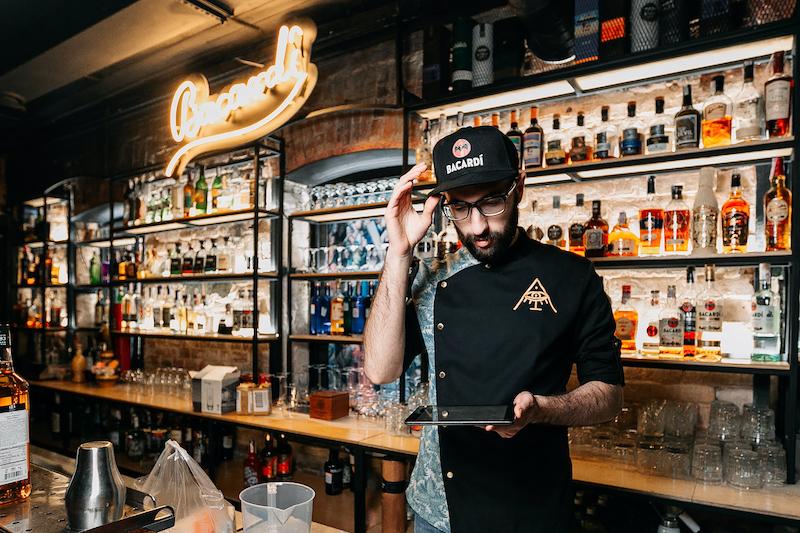 Bartender at the counter taking inventory