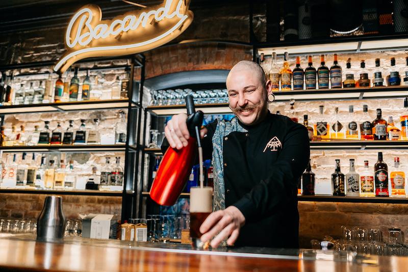 A bartender at a bar