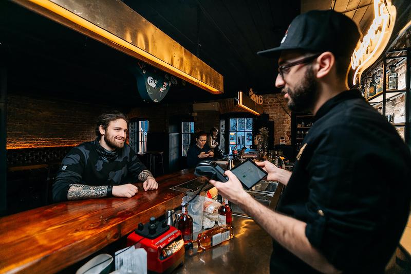 Bartender taking orders at the bar