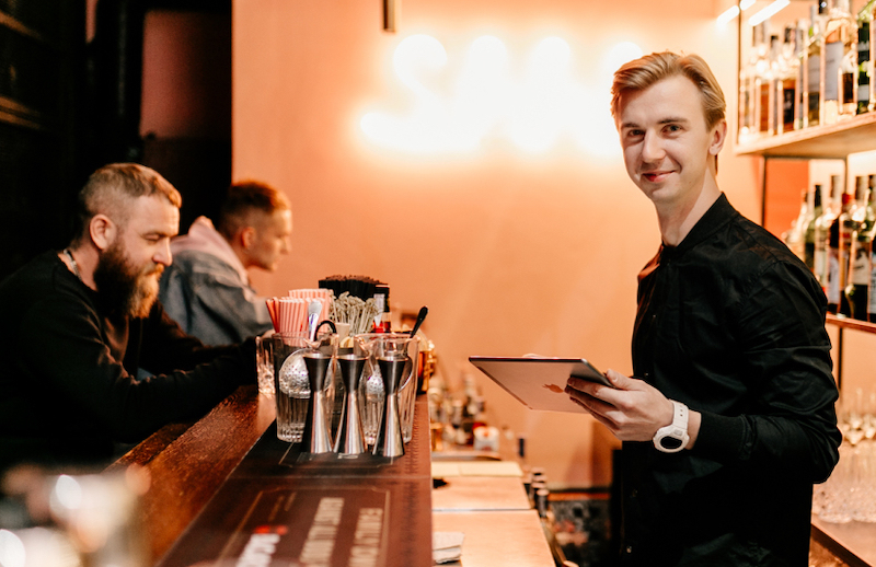 A bartender in a trendy bar A bartender in a trendy bar