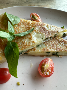 Pancake with cheese and tomato